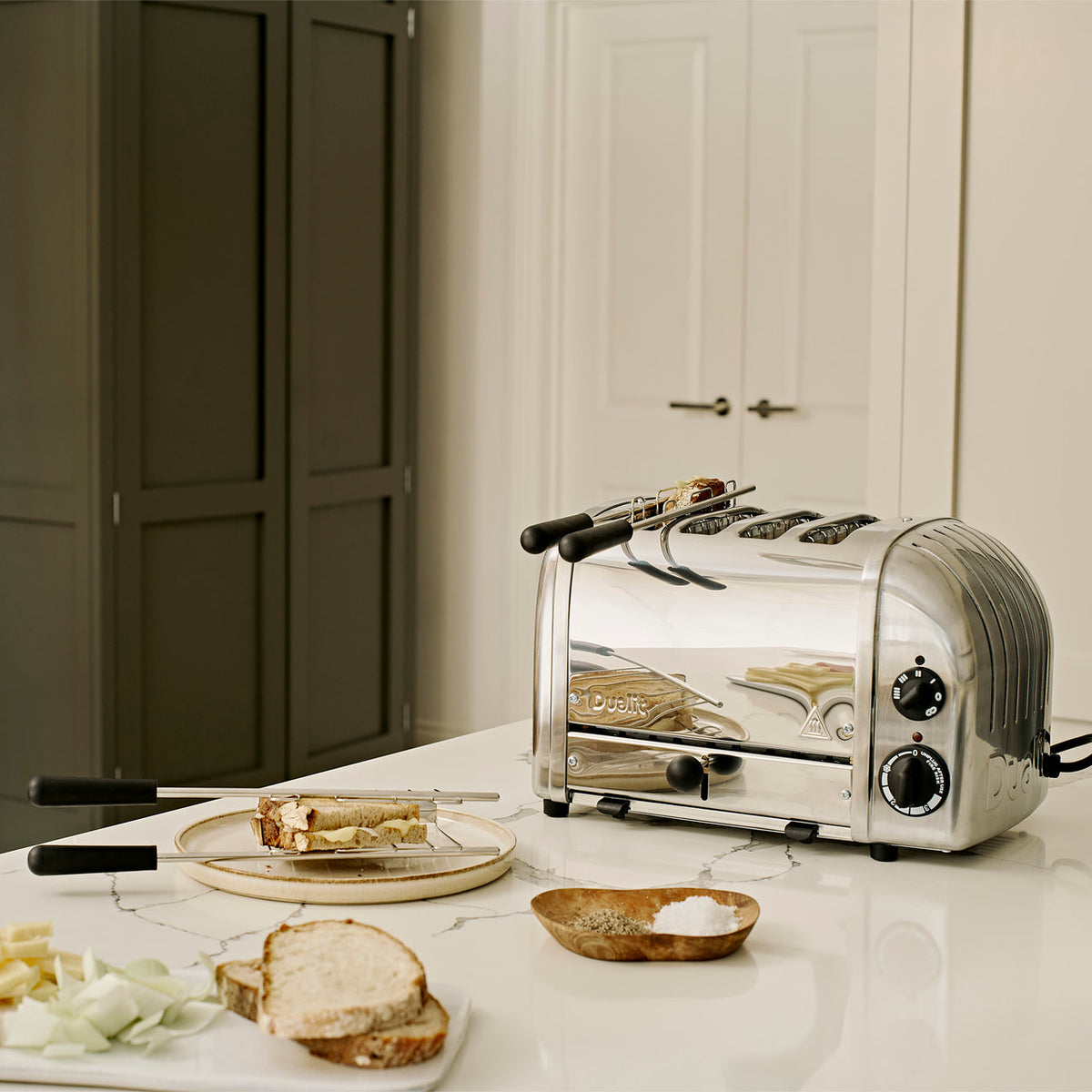 Dualit 4 Slice NewGen Classic Toaster Chrome sandwich preparation lifestyle